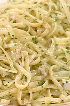 a plate full of pasta with chicken and broccoli