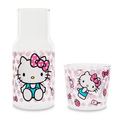 a hello kitty glass and cup set on a white background with pink polka dot dots