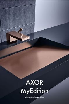 a bathroom sink with the words axor myedition on it's side