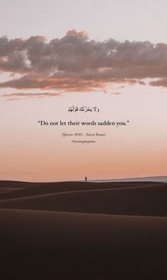 a person standing in the middle of a desert under a cloudy sky with an arabic quote