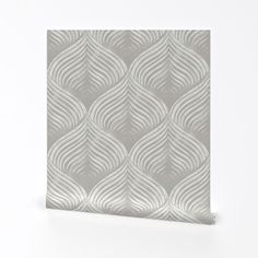 a white and grey wallpaper with wavy lines on it's side, against a white background