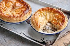 two pies sitting on top of a metal pan