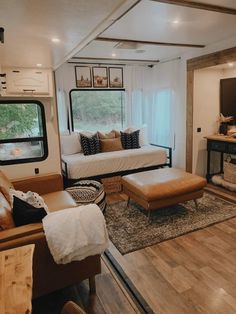 a living room filled with furniture and a large window