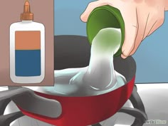 a person is pouring liquid into a pan