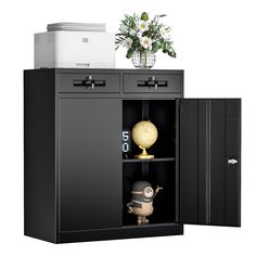 a black cabinet with two doors open and a vase on the top shelf next to it