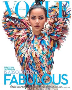 a magazine cover with an image of a woman wearing colorful clothing on the front page