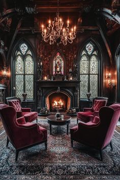 a living room with two red chairs and a fire place in the middle of it