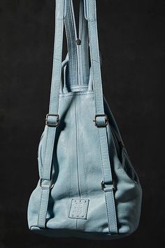 Designed to be slung over your shoulder or styled as a backpack, this soft leather sling bag from our We The Free collection features zippered details and defined top handles for added classic shape. * Lined interior * Zipper top closure * Adjustable belted strap | We The Free Soho Convertible Sling Bag at Free People in Blue Sling Bags Women, Blue Leather Bag, Denim Bags, Leather Sling Bag, Zipper Top, Zipper Detail, Senior Year, Boho Clothing, Bag Straps