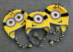 two crocheted hats with eyes on them