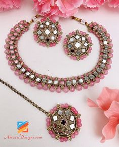 Pink Mirror Single Line Choker Necklace Studs Earrings Tikka Set Available to be shipped for FREE from Canada to USA, Europe, Italy, Norway and everywhere else. Explore more PUNJABI BRIDAL JEWELLERY SETS 👉 PUNJABI BRIDAL JEWELLERY ONLINE 🛒 INDIAN BRIDAL JEWELLERY 📦Unmatched FREE Worldwide Shipping Deepika, USA ⭐️⭐️⭐️⭐️⭐️ Thank you Thank you Thank you!! If I fell in love with the pictures, then I’m absolutely floored after seeing these bangles in person. Thank you for paying such close attenti Bridal Jewellery Online, Indian Choker, Rings And Necklaces, Indian Bridal Jewellery, Europe Italy, Pink Mirror, Jewellery Sets, Single Line, Studs Earrings