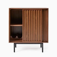 the sideboard is made out of wood and has an open door on one side