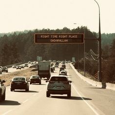 there are many cars driving down the road together in this traffic sign that says right time, right place