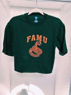 Florida A & M University (FAMU) crop top. It best fits a ladies medium but can fit size small for an oversized look. It is so cute and in very good condition. Green Crew Neck Crop Top For Streetwear, Casual Green Crop Top With Graphic Print, Green Crew Neck Crop Top Casual, Green Cropped T-shirt For Spring, Green Graphic Tee Crew Neck Crop Top, Green Crew Neck Graphic Tee Crop Top, Green Graphic Tee Crop Top With Crew Neck, Green Letter Print Crop Top For Summer, Green Letter Print Crop Top