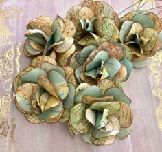 a bunch of paper flowers sitting on top of a table