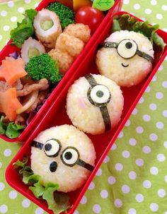 two red containers filled with food on top of a table