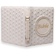 a white box with the word bible written in gold on it and an open zipper