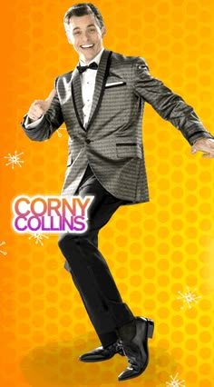 a man in a tuxedo dancing on an orange background