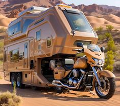 a motorcycle parked in the desert next to an rv