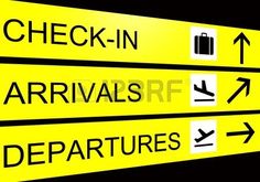 yellow and black directional signs pointing in different directions on a black background with the words check - in, arrivals, departures, and luggage