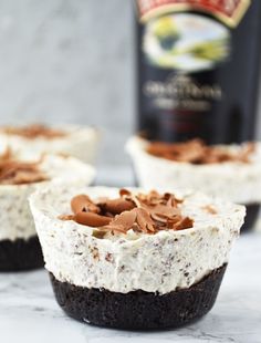 three desserts with chocolate and white frosting on them