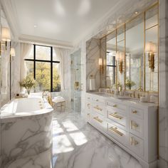 an elegant bathroom with marble counter tops and gold accents