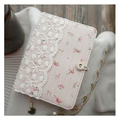 a pink and white purse sitting on top of a table