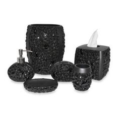 a black bathroom set with soap dispenser, toothbrush holder and tissue dispenser