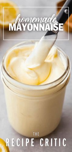 homemade mayonnaise in a small glass jar with a spoon sticking out of it