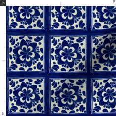 a blue and white tile pattern on the wall