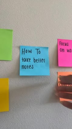 colorful sticky notes pinned to the wall with words on them that read how to take better notes