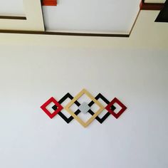 the wall is decorated with geometric shapes