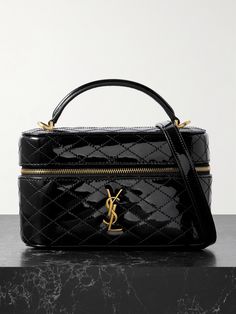 Like many of the designs in SAINT LAURENT's 'Gaby' collection, this mini bag is made from smooth, quilted patent-leather and embellished with its iconic gold-tone 'Cassandre' logo. It will accommodate all of your small essentials, including a phone, cardholder, and keys. Carry it by the top handle or style it cross-body with the detachable long strap. Vintners Daughter, Saint Laurent Makeup, Vanity Bag, Fine Watches, The Saint, Essential Items, Saint Laurent Bag, Right Time, Ski Wear