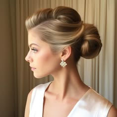 Timeless and elegant, a classic updo is perfect for a traditional bride. Audrey Hepburn Inspired Wedding Hair, Long Hair Bride Updo, Wedding Hairstyles Updo Elegant Classy, Vintage Style Updos, Old Hollywood Updo Wedding, Old Fashion Updos, 1920 Updo Hairstyles, Classic Updo Hairstyles Vintage, Old Money Updo