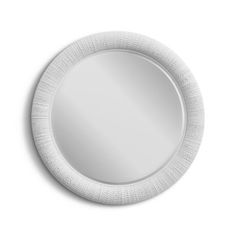 a white plate with a circular mirror on the wall above it, isolated against a white background