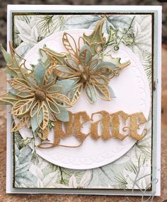 a close up of a card with flowers on it and the word merry written in gold