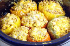 stuffed bell peppers with cheese and seasoning in the crock pot for an appetizer