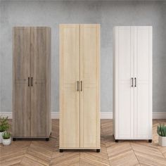 three tall wooden cupboards sitting next to each other in a room with wood flooring