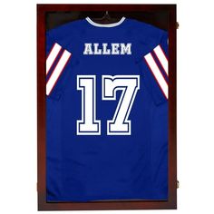 a football jersey hanging in a wooden frame with the name and number 17 on it