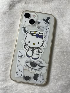 an iphone case with hello kitty stickers on it