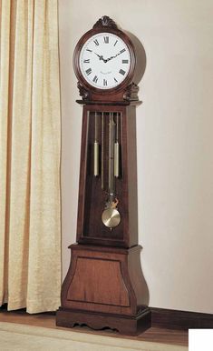 a grandfather clock sitting in front of a window