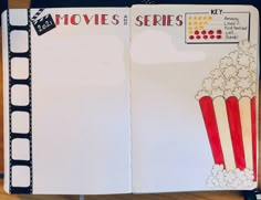 an open notebook with film strip and popcorn on it