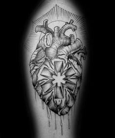 a black and white photo of a heart tattoo