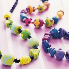 several colorful beads are arranged on a table