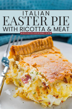 a white plate topped with an omelet and meat pie next to a fork