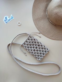 a hat, purse and other items are laid out on a table together to be used as jewelry