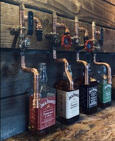 several different types of liquor are lined up on the wall