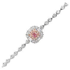 18K White Gold Cushion-Cut Fancy Pink Diamond Bracelet with Diamonds 1 Pink Diamond - 0.15 CT Diamonds - 0.92 CT (VS; F Colour) 18K Gold - 4.9 GM The pink diamond is a captivating and rare gemstone, its hue evoking the most delicate and precious things in nature. Regarded as one of the most sought-after diamonds, the pink diamond is a symbol of elegance, exclusivity, and refined taste. For this exquisite bracelet, we have carefully selected a vivid pink 0.15CT diamond, whose radiant color seems Luxury Pink Diamond Bracelet For Anniversary, Elegant Pink Diamond Bracelet For Formal Occasions, Elegant Rose Gold Bracelet For Formal Occasions, Elegant Pink Gold Bracelet For Formal Occasions, Formal Pink Diamond Bracelet With 17 Jewels, Pink Diamond Bracelet, The Most Beautiful Flowers, Bracelet With Diamonds, Glamour Nails