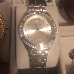 Brand New Guess Silver Watch. With Patterned Rhinestones Around The Frame. Guess Watches Women Silver, Elegant Metal Watch With Rhinestones, Elegant Metal Watches With Bling, Elegant Metal Watches With Rhinestones, Elegant Embellished Metal Watches, Formal Metal Watches With Bling, Formal Stainless Steel Watches With Rhinestones, Guess Watches Women, Guess Aesthetic