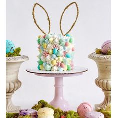 there is a cake decorated with eggs and flowers