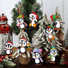 small christmas trees decorated with penguins and snowmen